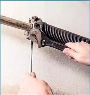 Garage door torsion spring repair and replacement